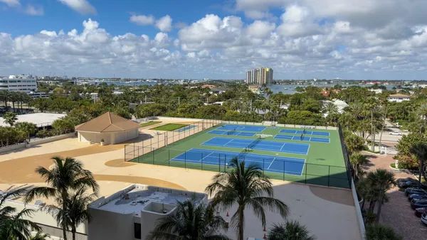 a view of parking area with cars parked