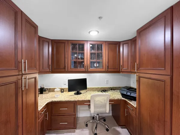 a kitchen with a refrigerator and a sink