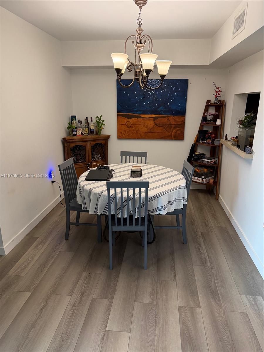 11750 Southwest 18th Street, Unit 5271 Miami, FL 33175 - Photo 8 of 8 a bedroom with a bed table and chair