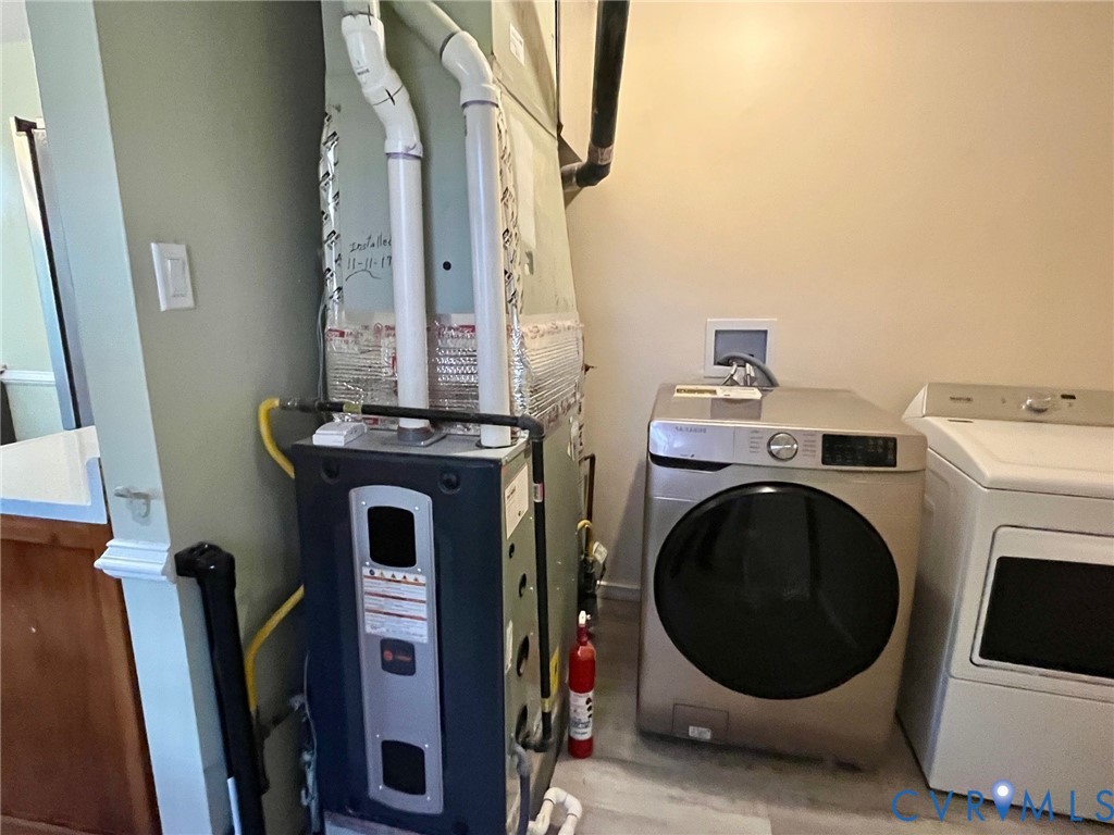 3911 Sunburst Road Henrico, VA 23294 - Photo 12 of 27 a view of a storage and utility room with washer and dryer