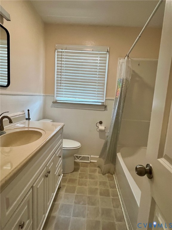 3911 Sunburst Road Henrico, VA 23294 - Photo 15 of 27 a bathroom with a sink a toilet and a mirror