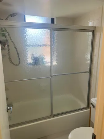 a bedroom with a bed and a walk in closet