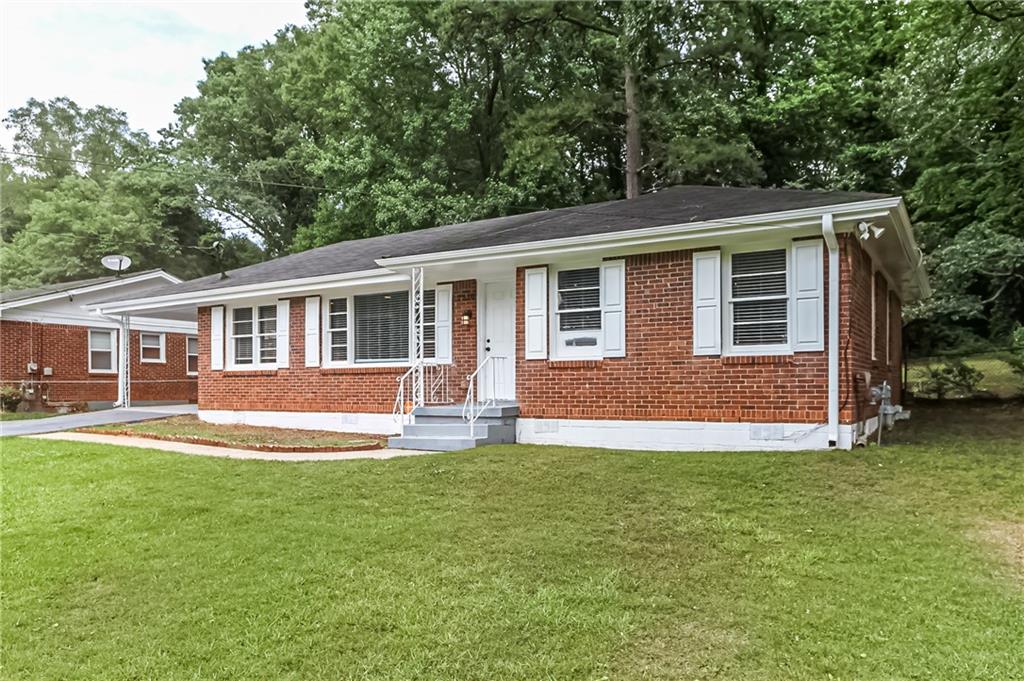 2310 Amber Way Decatur, GA 30032 - Photo 1 of 1 a front view of house with yard and green space