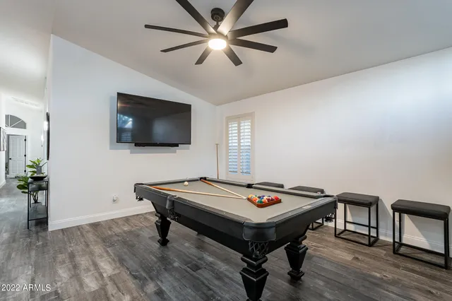a spacious bathroom with a double vanity sink a mirror and a bathtub