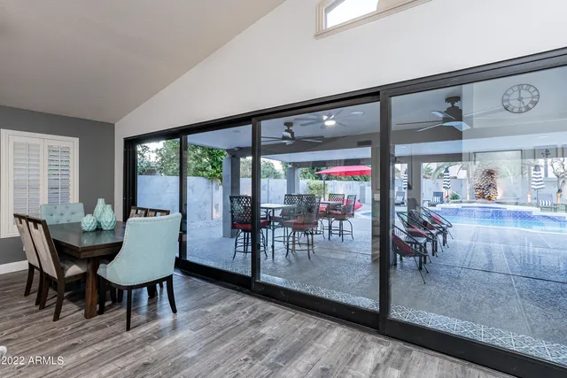 a white bath tub sitting in a bathroom next to a window
