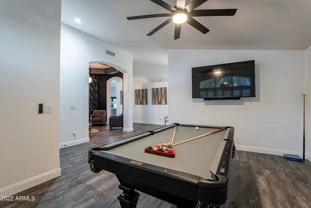 a view of a swimming pool with a patio