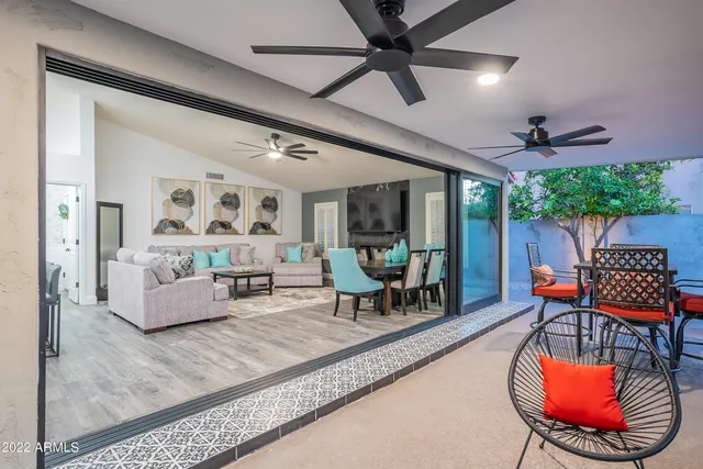 a view of a swimming pool with an outdoor space and seating area