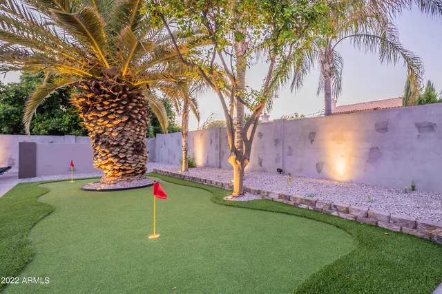 a living room with furniture a air conditioner and a window