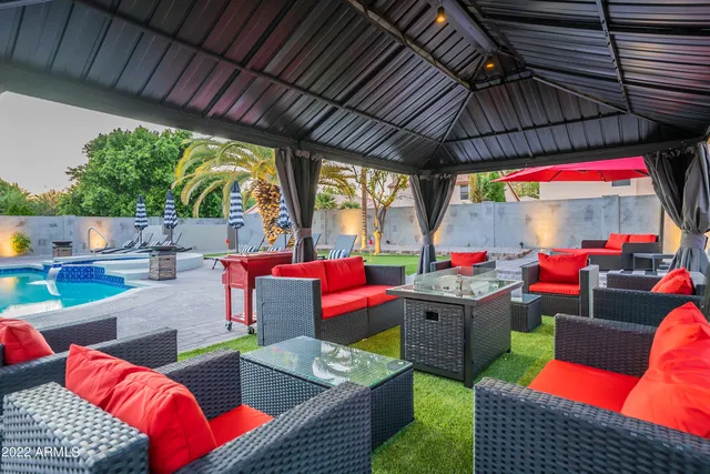 a living room with furniture and a rug