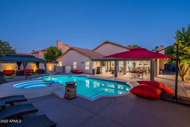 a view of a lake with a house in the background