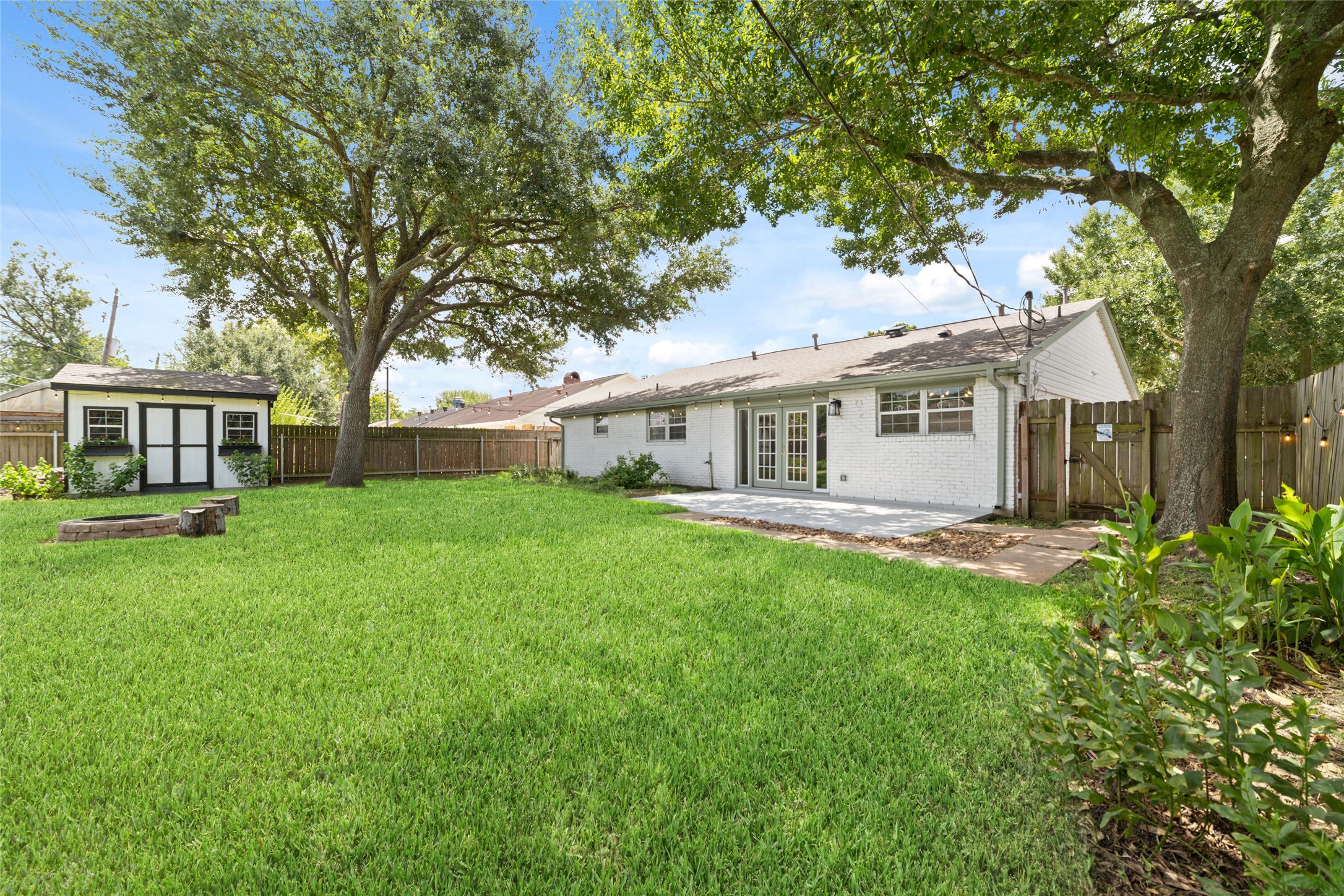 5922 Hummingbird Street Houston, TX 77096 - Photo 24 of 26 One of this home's biggest flexes is the oversized backyard with no rear neighbors, giving you the space and privacy that's becoming harder to find. The charming garden shed is ready to become your potting shed, workshop, art studio, or weekend project space, while a recent roof, never-flooded history, and location outside the floodplain make this backyard just as smart as it is inviting.