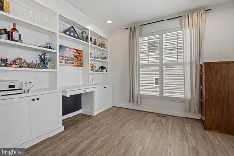 a bathroom with a sink shower and a mirror