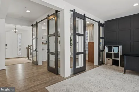 a white bath tub sitting in a bathroom next to a window