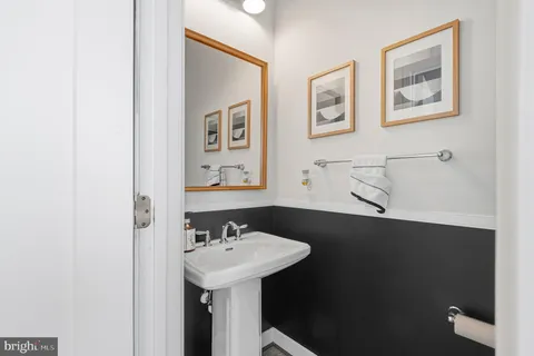 a kitchen with stainless steel appliances granite countertop a counter top space cabinets and chairs