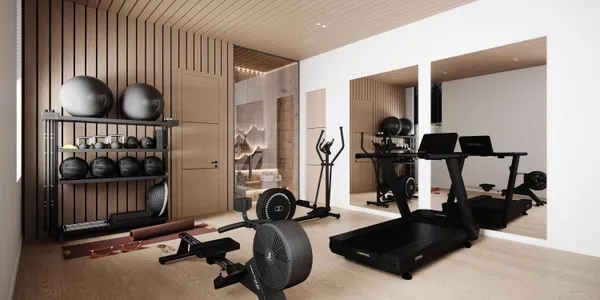 a room with gym equipment and a flat screen tv