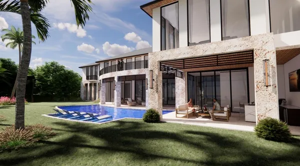 an aerial view of a house with outdoor space and a lake view