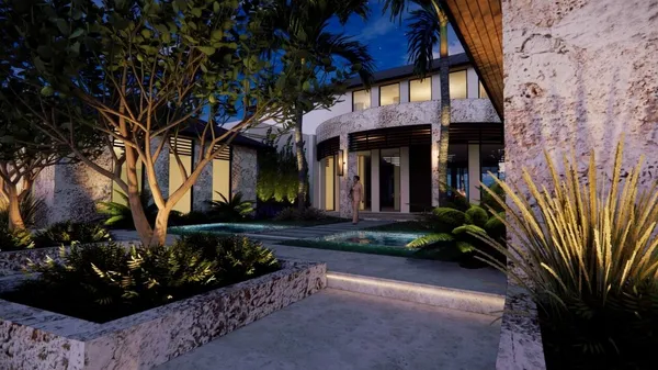 a view of a house with a yard and potted plants