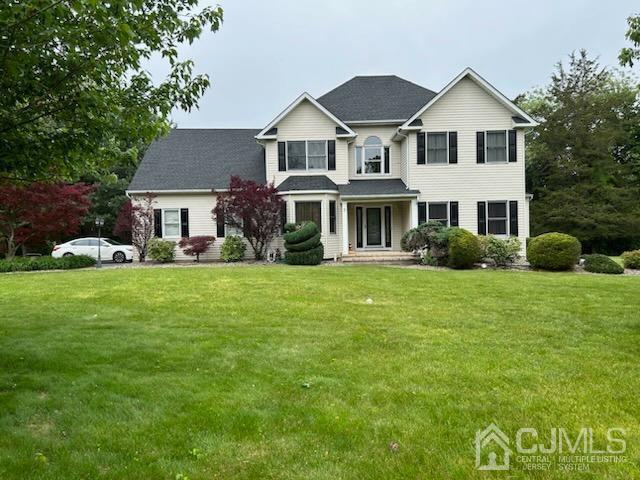 9 Hunters Crossing Road Somerset, NJ 08873 - Photo 1 of 1 a front view of a house with garden and trees