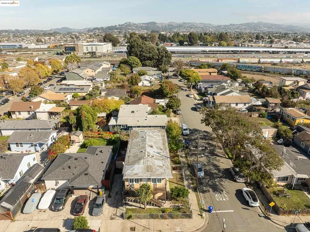an aerial view of residential houses with outdoor space