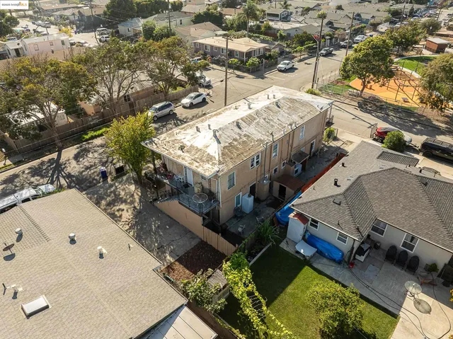 an aerial view of a house with a yard basket ball court