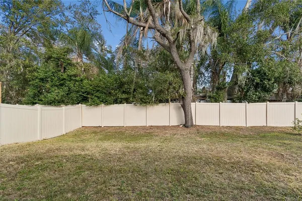 a view of a house with backyard