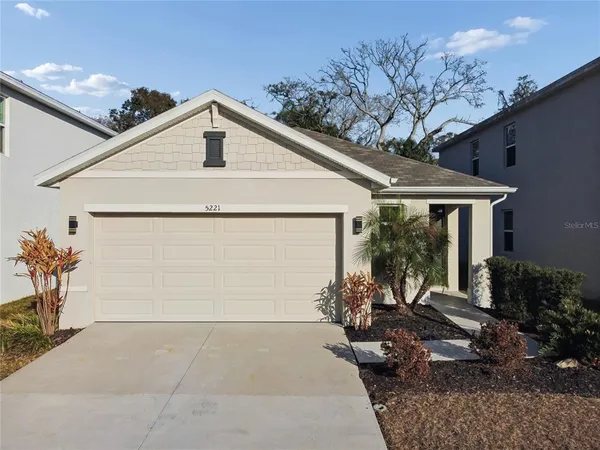 a aerial view of a house with a yard