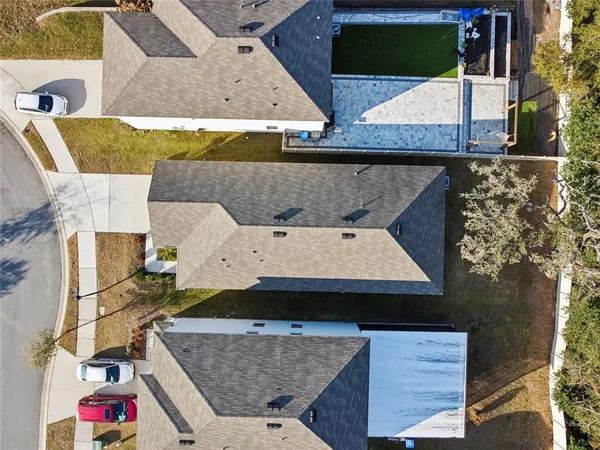 an aerial view of residential building with parking space