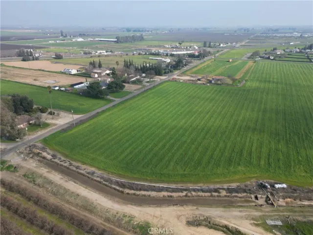 an aerial view of a golf course with parking space