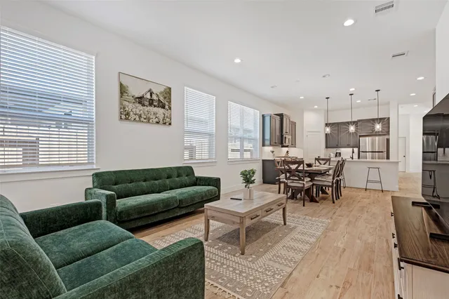 a spacious bedroom with a bed and a window