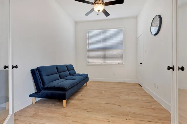 a living room with furniture and a window