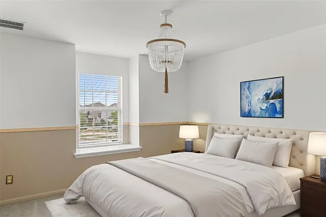 a bedroom with bed and window