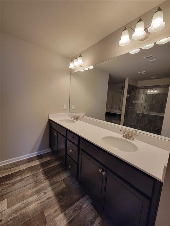 5205 Fox Den Road Oakwood, GA 30566 - Photo 13 of 19 a bathroom with a sink and a mirror