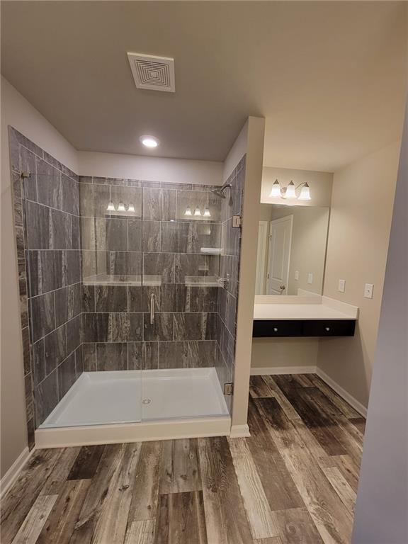 5205 Fox Den Road Oakwood, GA 30566 - Photo 14 of 19 a bathroom with a tub and shower