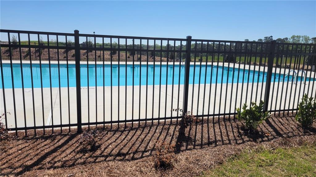 5205 Fox Den Road Oakwood, GA 30566 - Photo 19 of 19 a view of a black gate