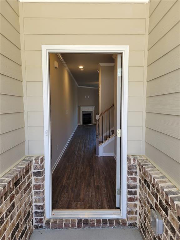 5205 Fox Den Road Oakwood, GA 30566 - Photo 3 of 19 a view of a hallway with wooden floor and staircase