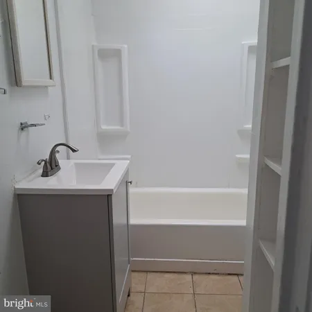 a bathroom with a sink and a bathtub