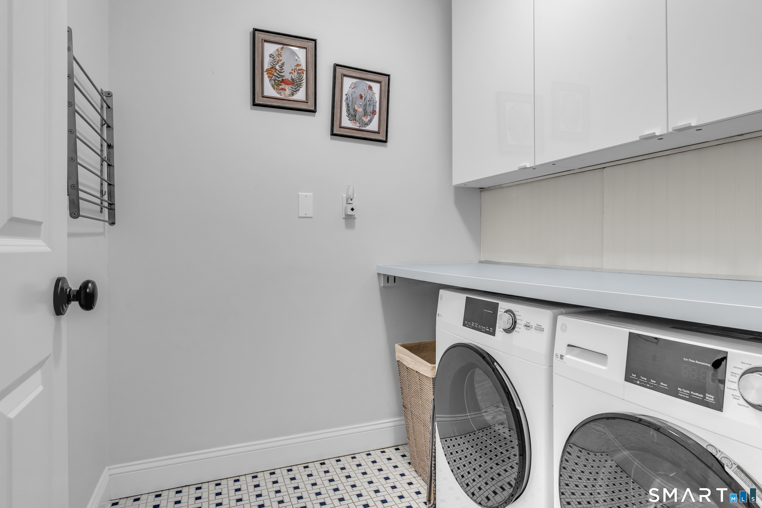 63 Broad Street Guilford, CT 06437 - Photo 25 of 40 a utility room with dryer and washer