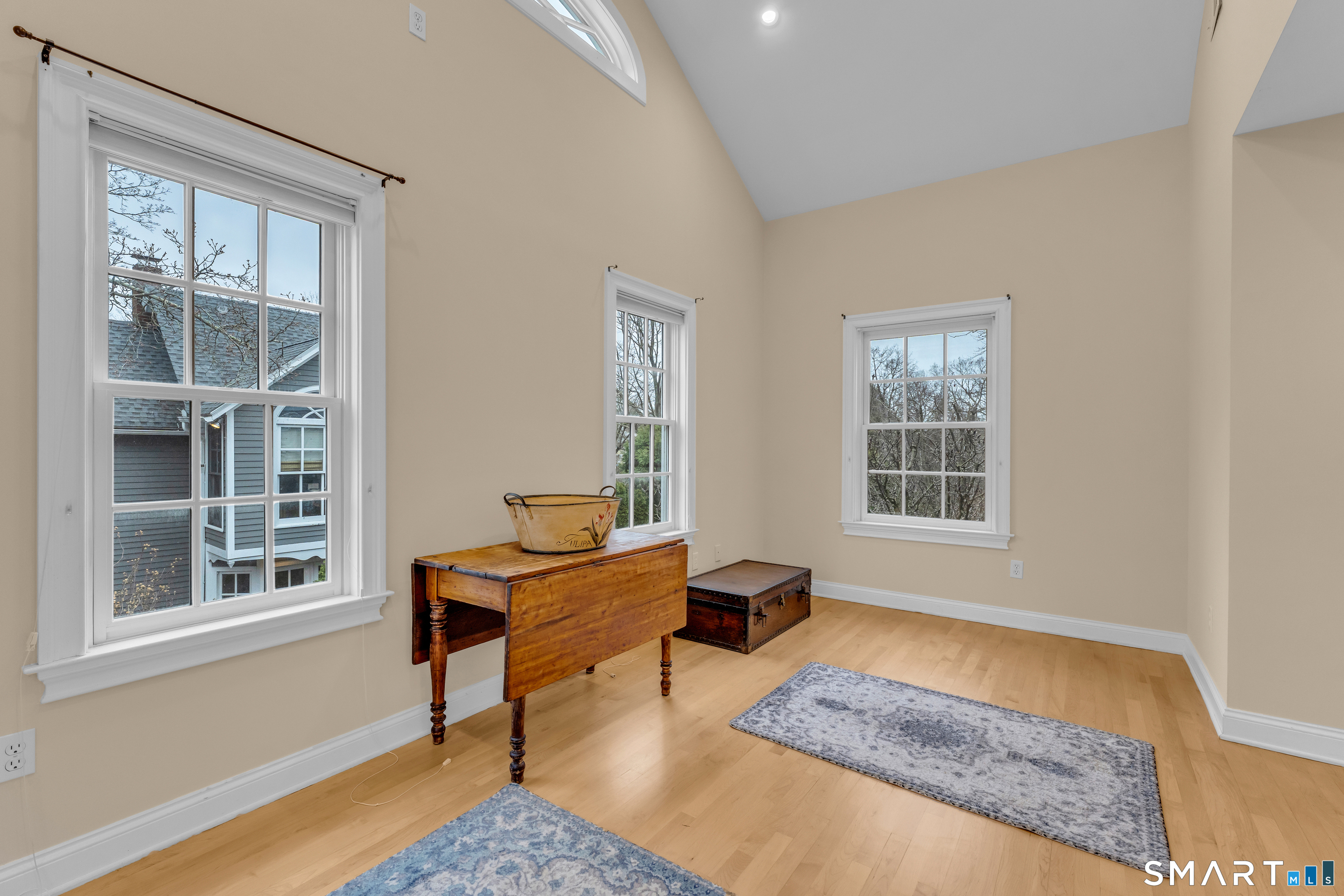 63 Broad Street Guilford, CT 06437 - Photo 29 of 40 a living room with furniture and a window