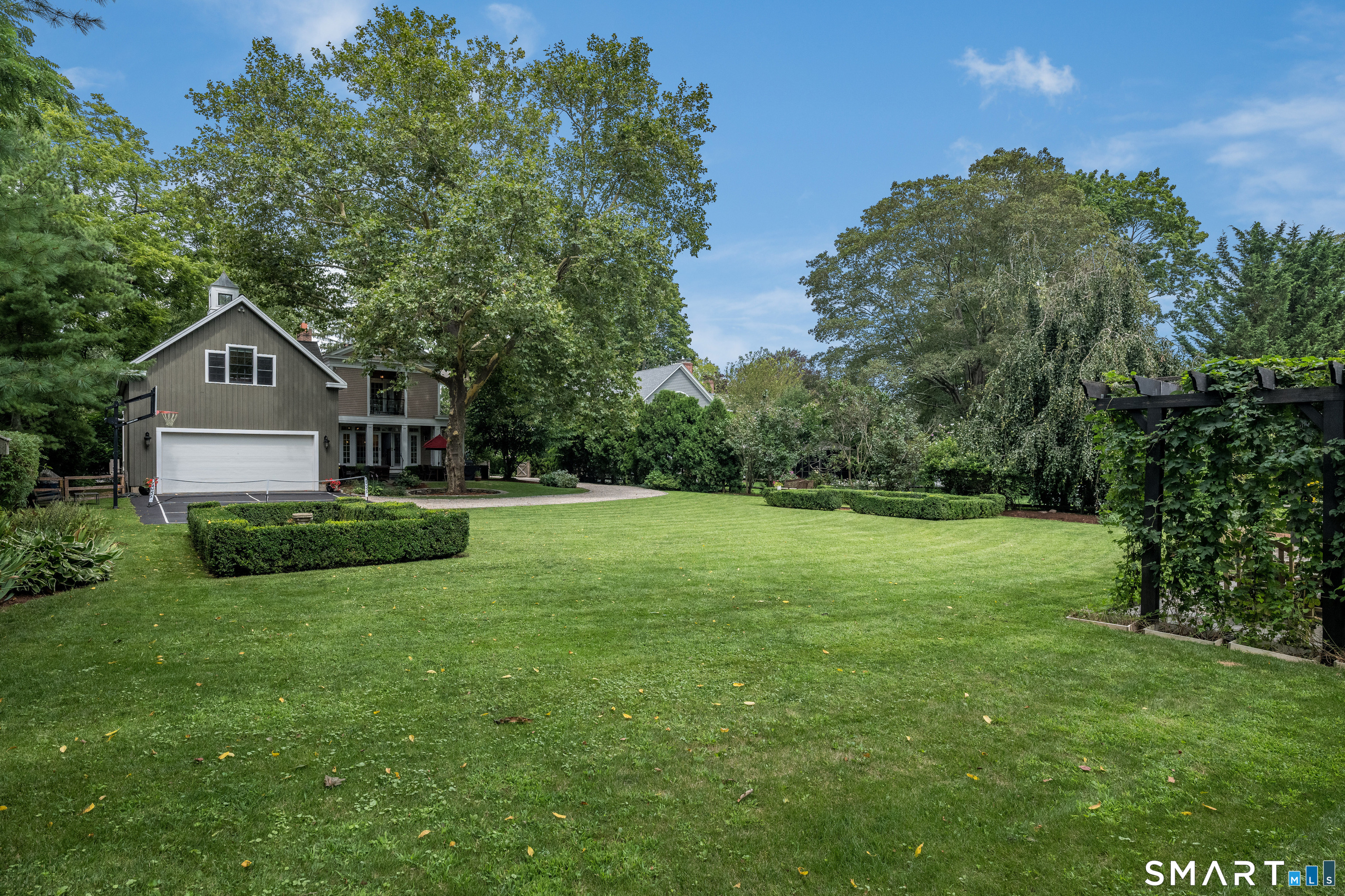 63 Broad Street Guilford, CT 06437 - Photo 33 of 40 a front view of a house with a yard