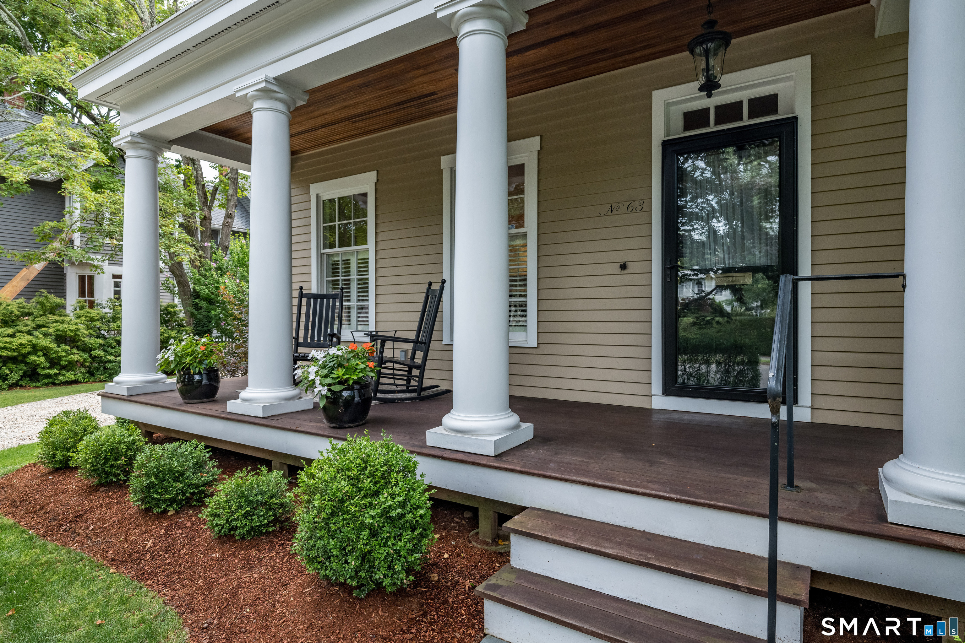 63 Broad Street Guilford, CT 06437 - Photo 35 of 40 a house view with a garden space