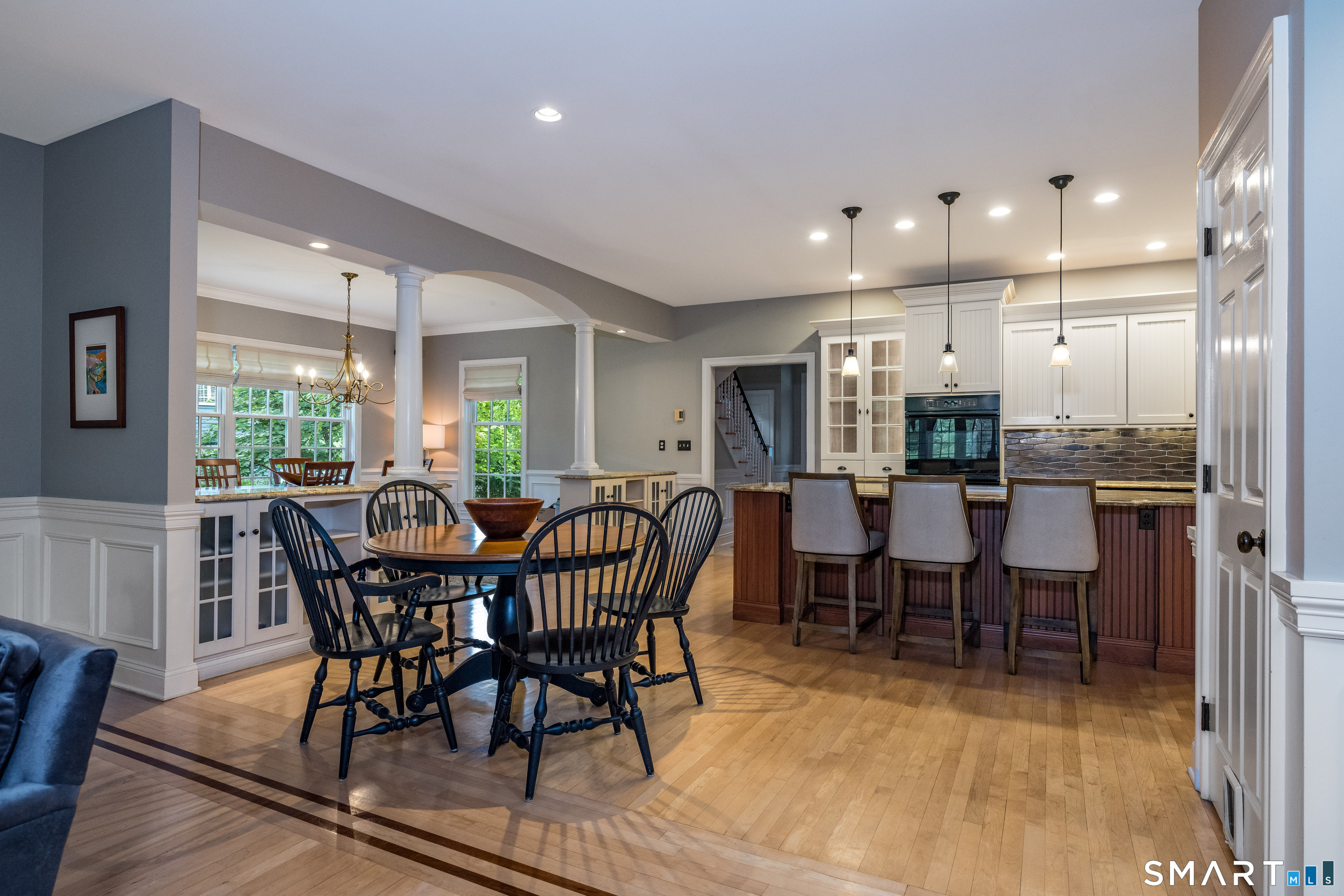 63 Broad Street Guilford, CT 06437 - Photo 8 of 40 a view of a dining room with furniture window and wooden floor