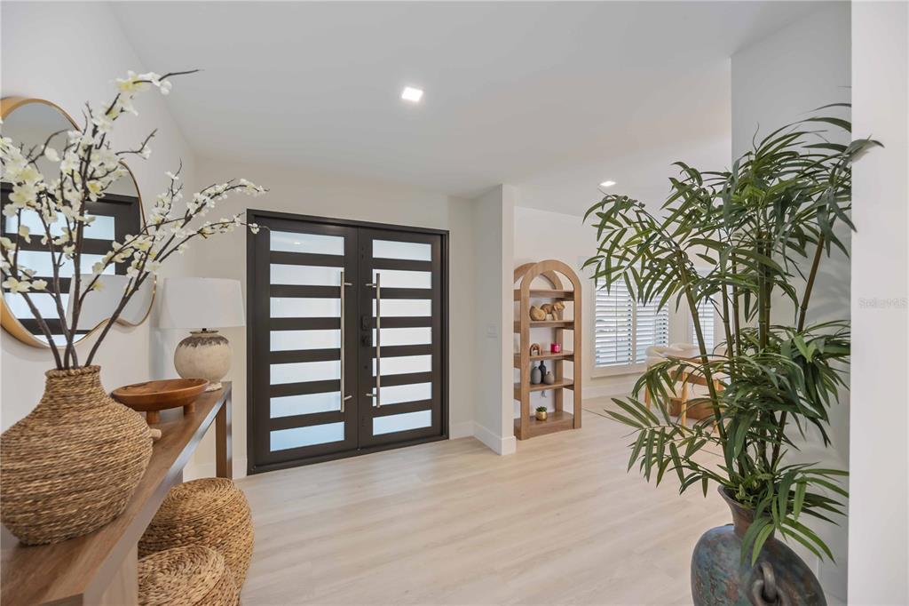 105 Sinclair Street Southeast Port Charlotte, FL 33952 - Photo 11 of 69 a view of a livingroom with a potted plant and couches