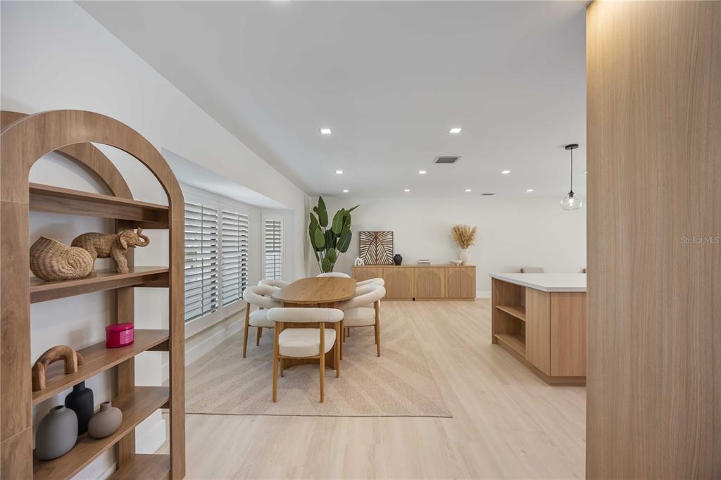 105 Sinclair Street Southeast Port Charlotte, FL 33952 - Photo 12 of 69 a living room with furniture and a wooden floor