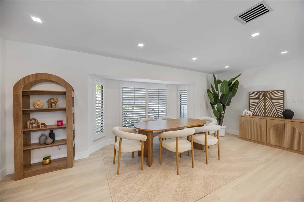 105 Sinclair Street Southeast Port Charlotte, FL 33952 - Photo 13 of 69 a view of a workspace with furniture and window