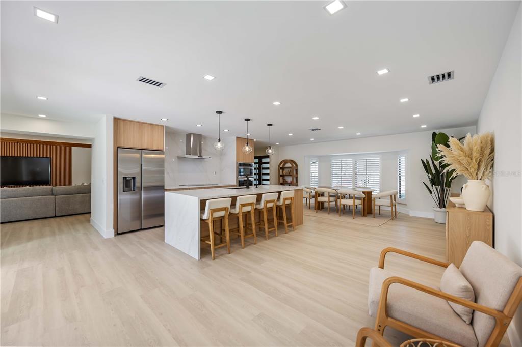 105 Sinclair Street Southeast Port Charlotte, FL 33952 - Photo 17 of 69 a living room with stainless steel appliances furniture and a kitchen view