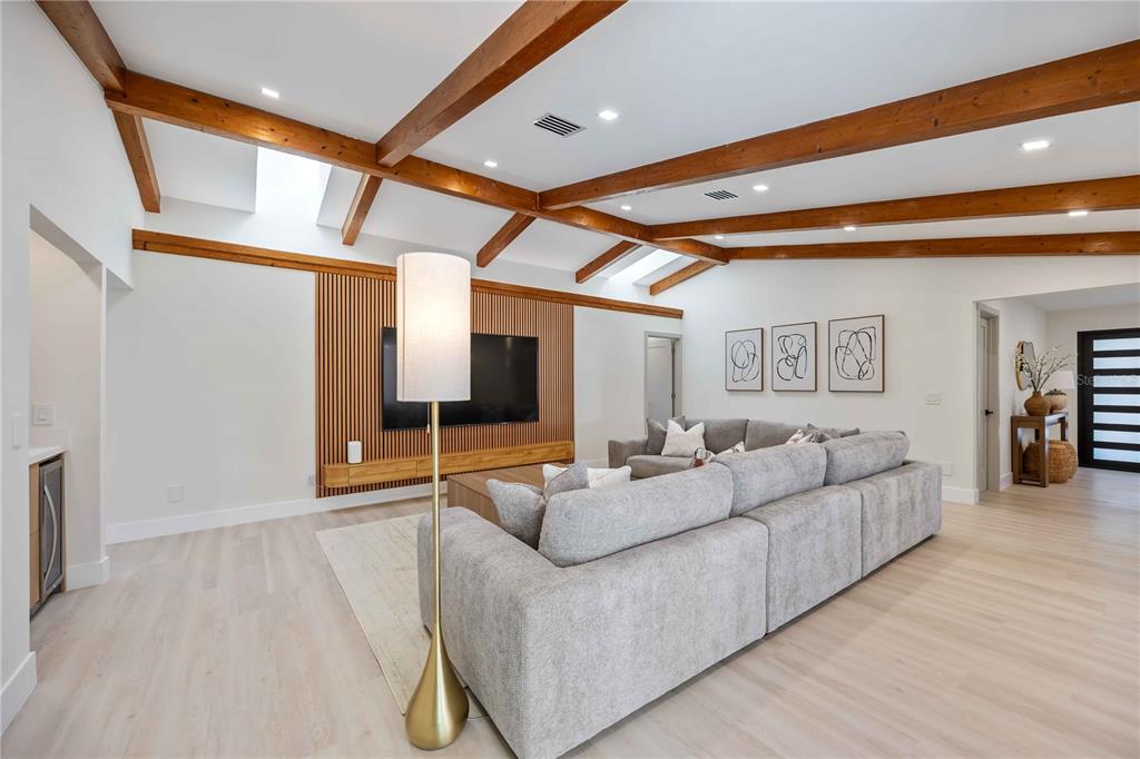 105 Sinclair Street Southeast Port Charlotte, FL 33952 - Photo 20 of 69 a living room with furniture and a flat screen tv