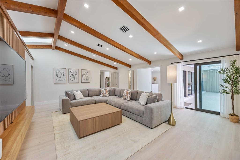 105 Sinclair Street Southeast Port Charlotte, FL 33952 - Photo 21 of 69 a living room with furniture and a large window