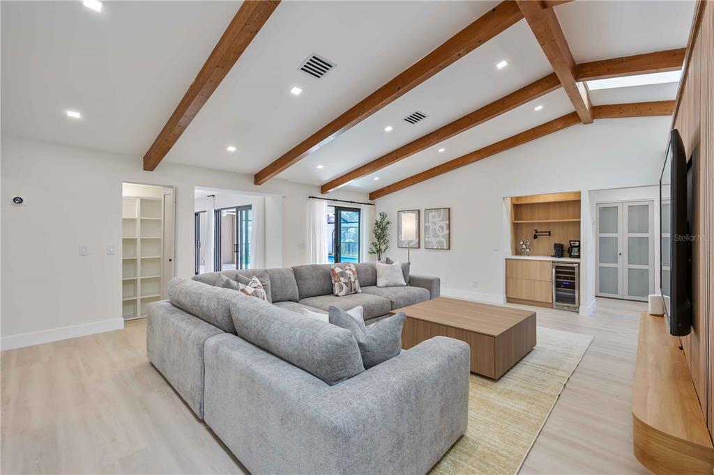 105 Sinclair Street Southeast Port Charlotte, FL 33952 - Photo 22 of 69 a living room with furniture and a flat screen tv