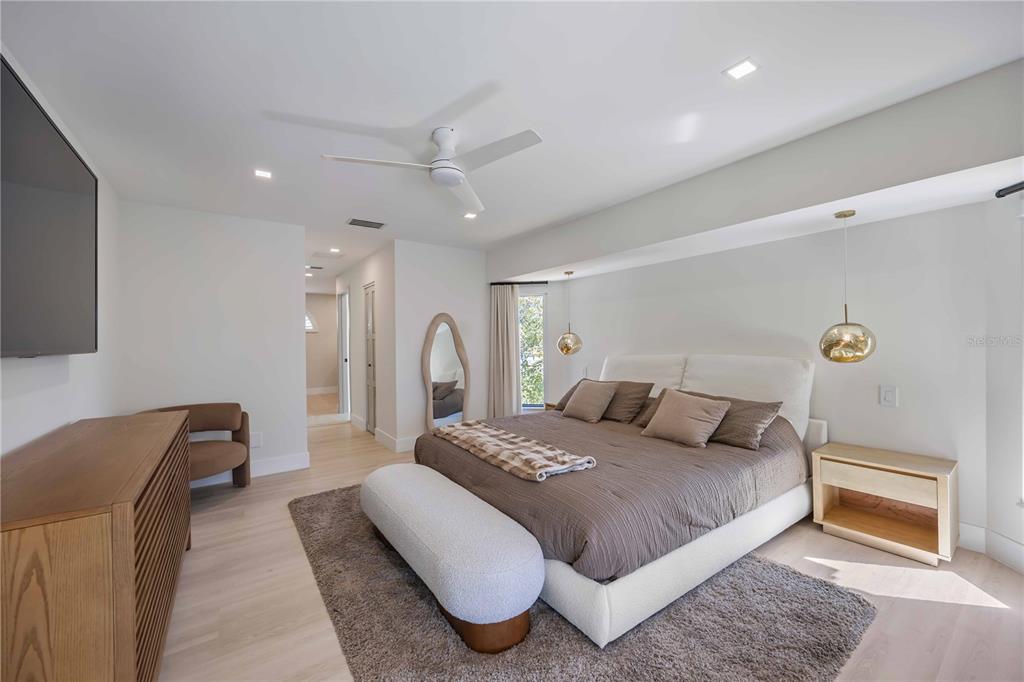 105 Sinclair Street Southeast Port Charlotte, FL 33952 - Photo 24 of 69 a bedroom with a bed and a couch