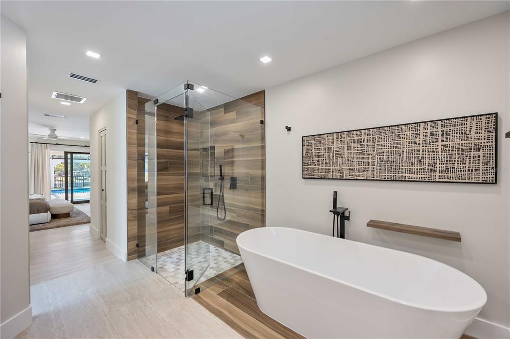 105 Sinclair Street Southeast Port Charlotte, FL 33952 - Photo 27 of 69 a bathroom with a bathtub and a shower